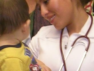 2008 SB Neighborhood Clinics nurse with a little patient 