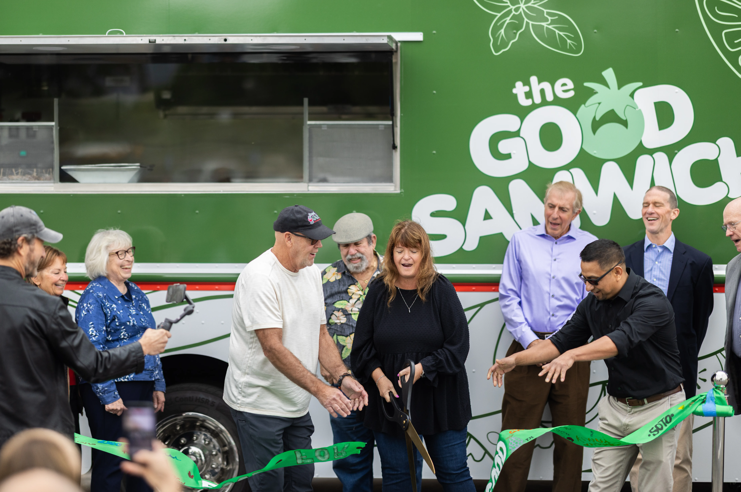 Good Samaritan CEO Sylvia Barnard (center) was joined by a large group of assorted well-wishers and co-conspirators at the Santa Barbara Mission on Tuesday for a ribbon-cutting to celebrate the new Good Samwich food truck. | Credit: Ingrid Bostrom