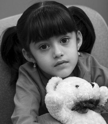 CASA Court Appointed Special Advocates: little girl with white teddy bear