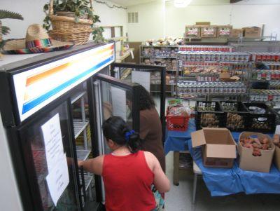 Catholic Charities: food pantry with customers