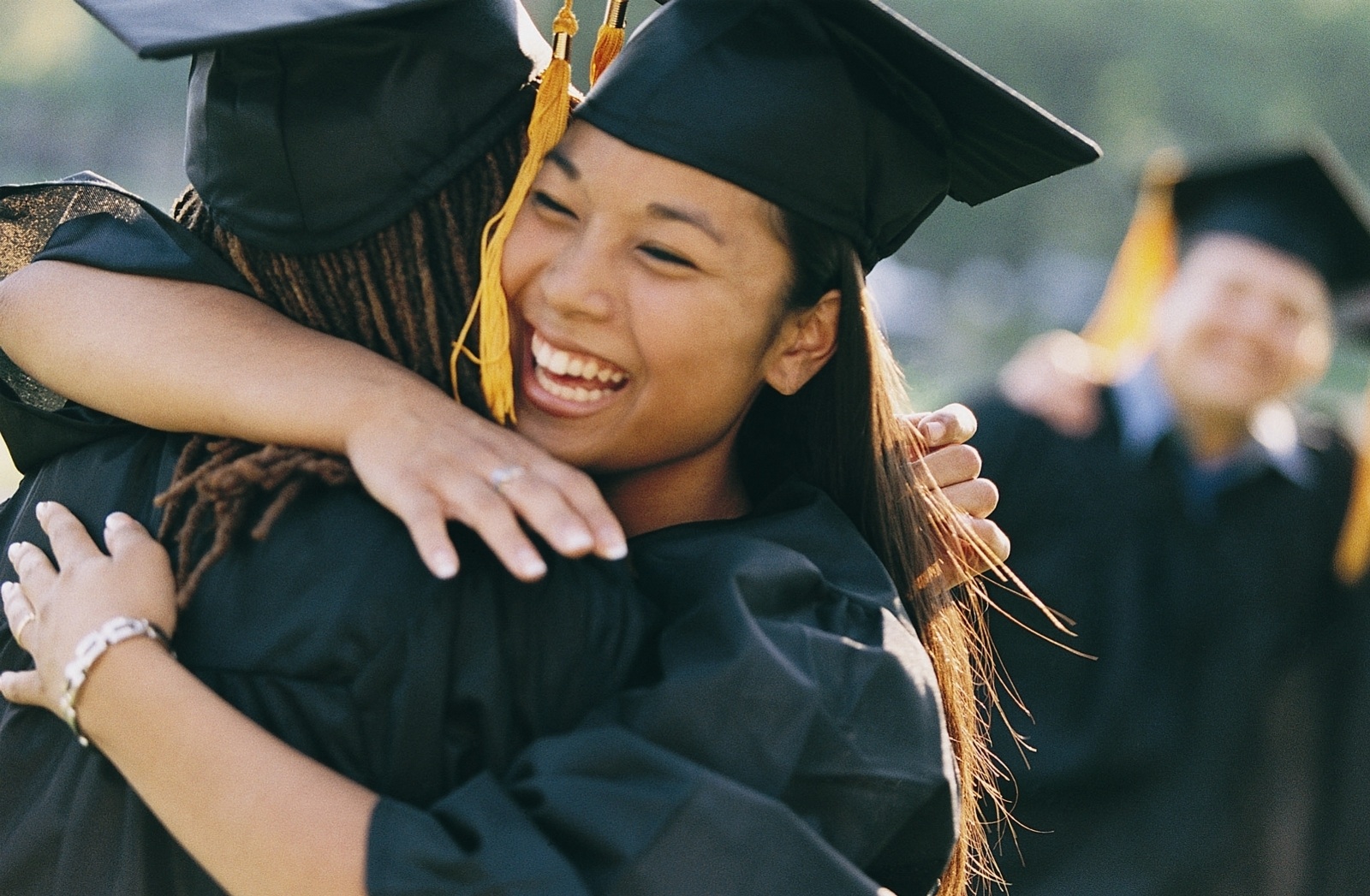 Childrens Academy graduates happily hugging