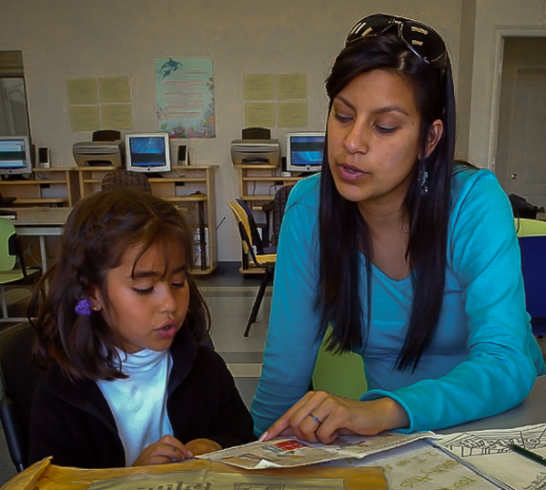 People's Self-Help Housing: tutor working with young student