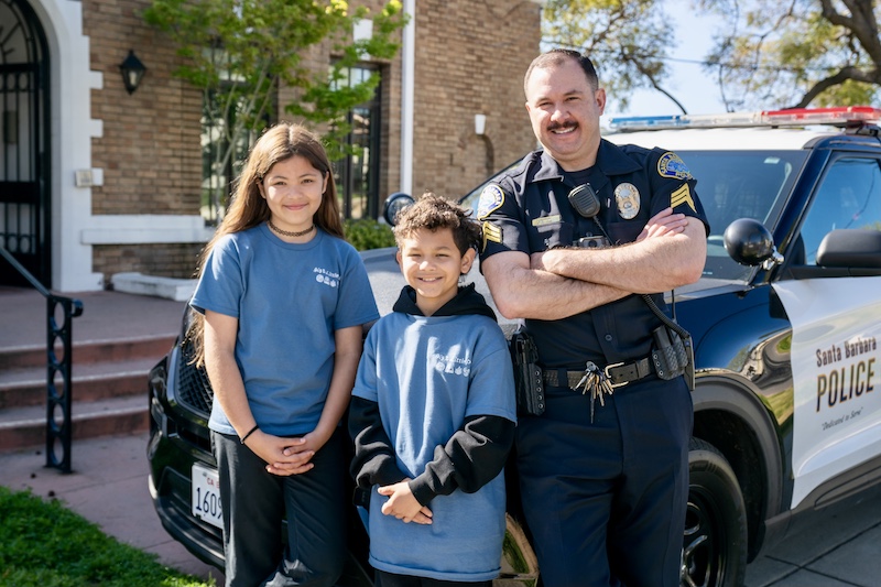 Police Activities League members with officer