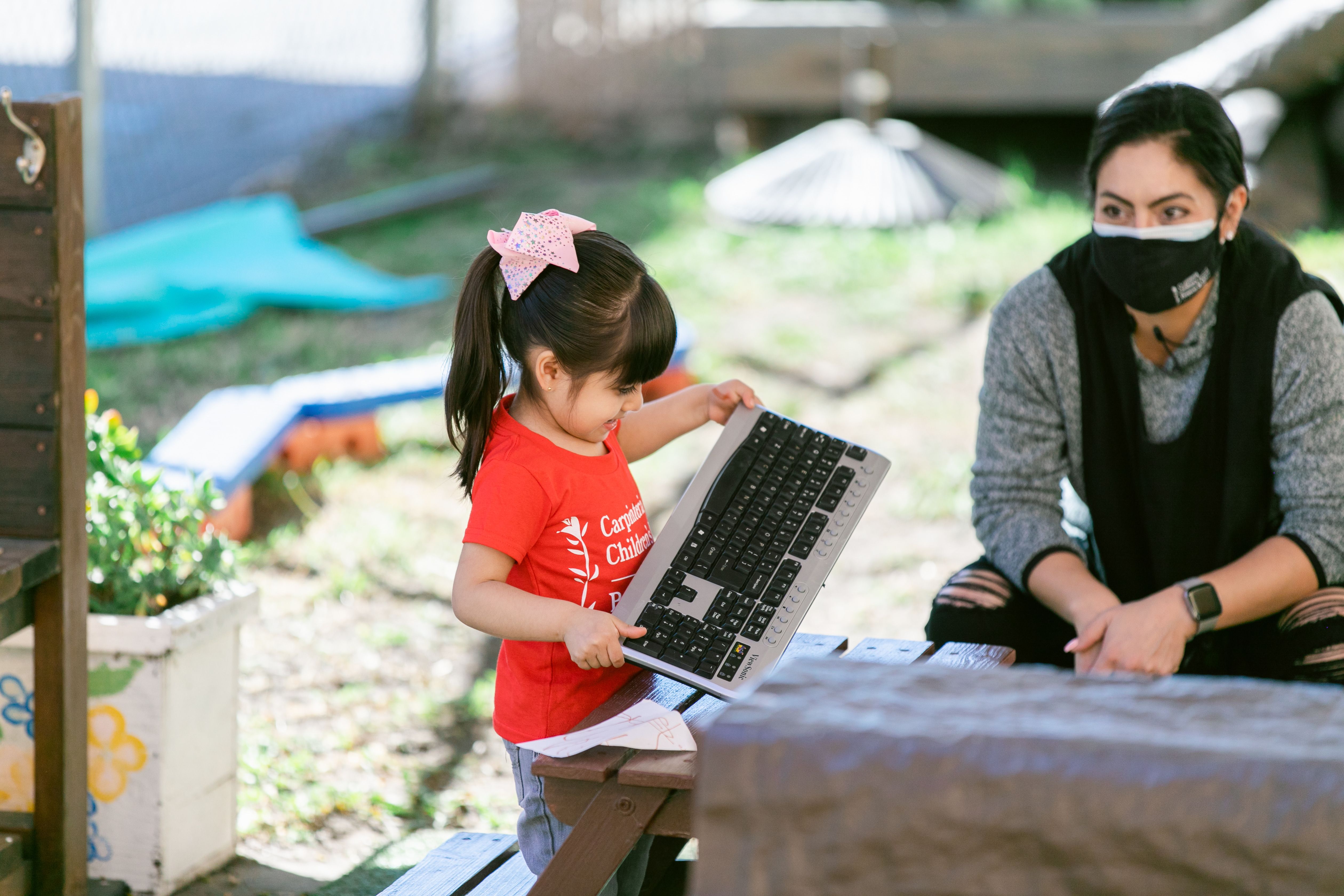 child with child care worker