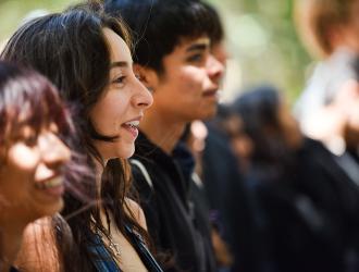 Students listing to program