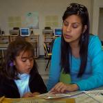 People's Self-Help Housing: tutor working with young student